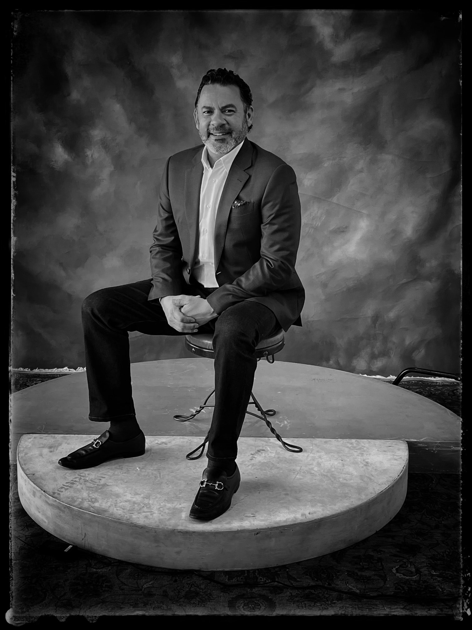 Dramatic black and white portrait of Luis Arandia, Men's Wardrobe Consultant